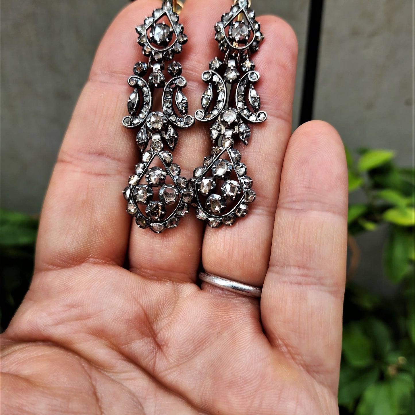 Antique Silver Diamond Iberian Earrings front view, held in hand