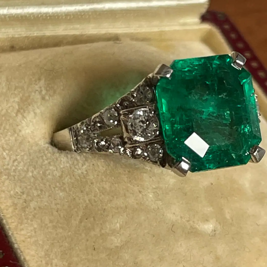 Art Deco Platinum Colombian Emerald Ring front side view in jewelry box