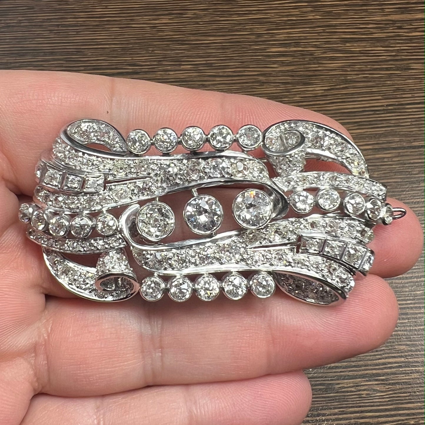 Art Deco Platinum Diamond Brooch in hand