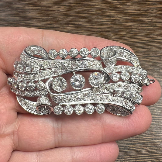 Art Deco Platinum Diamond Brooch in hand