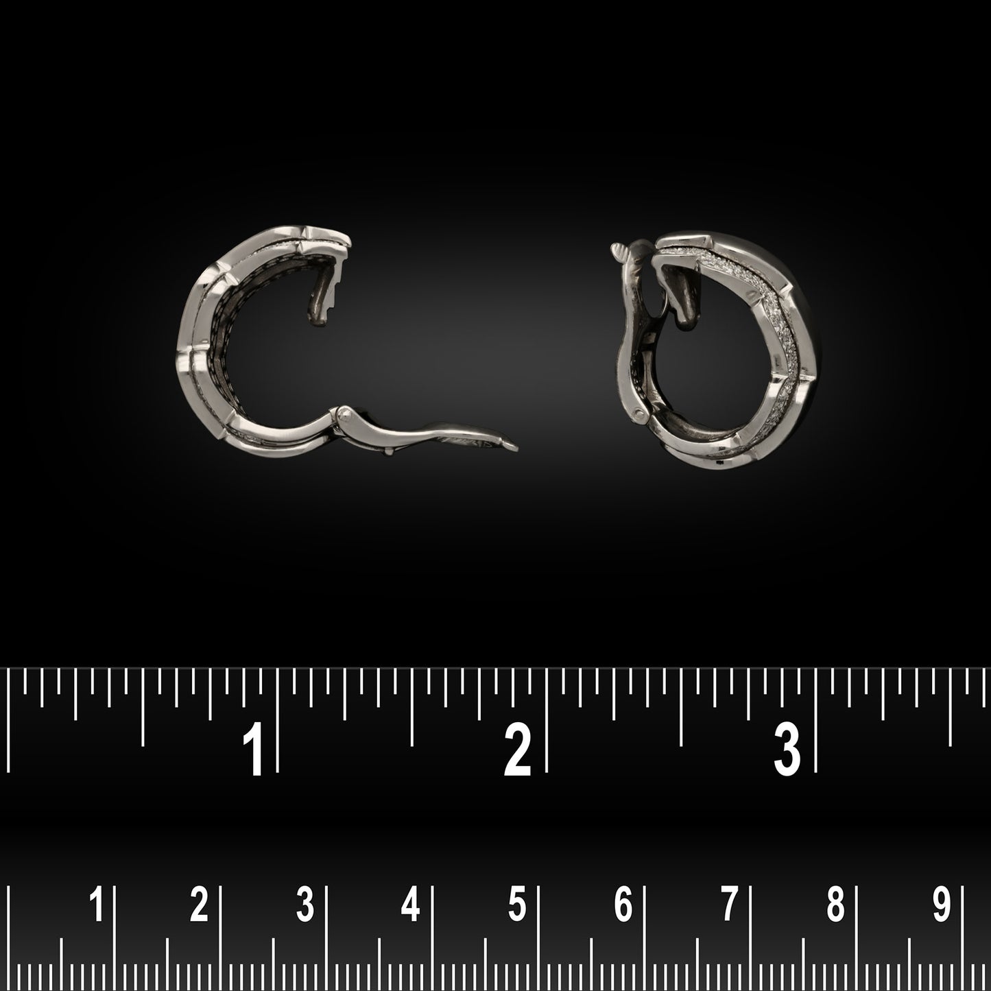 French Van Cleef & Arpels Post-1980s 18KT White Gold Diamond Wave Hoop Earrings side view with ruler