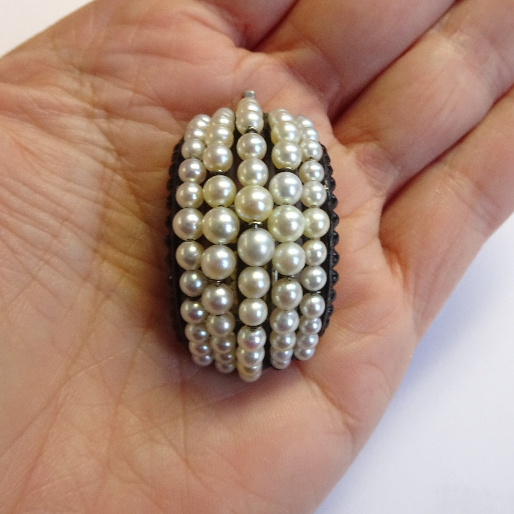 Suzanne Belperron & Rene Boivin 1930s Silver Natural Pearl & Enamel Brooch in hand