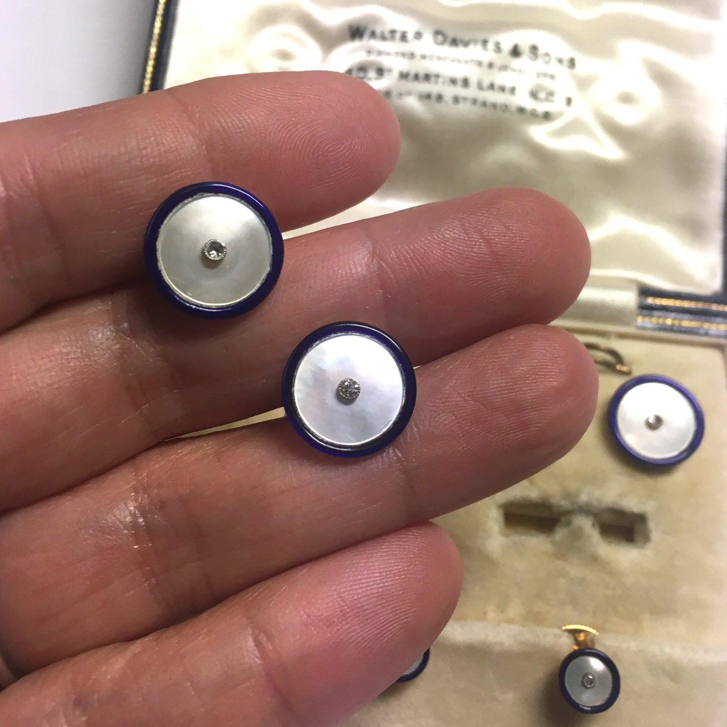 1930s 18KT Yellow Gold Enamel, Diamond & Mother of Pearl Dress Set in hand