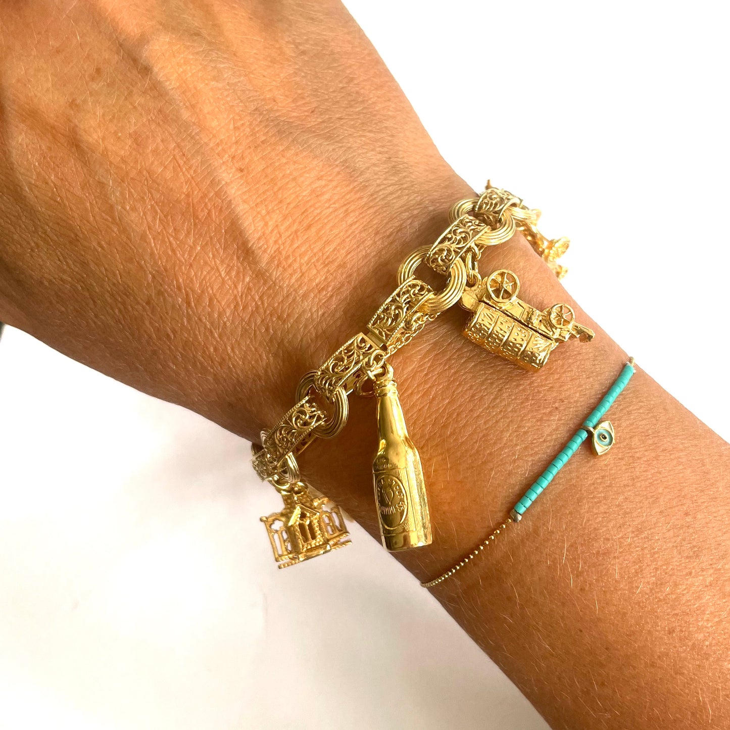 1950s 9KT Yellow Gold Charm Bracelet worn on wrist