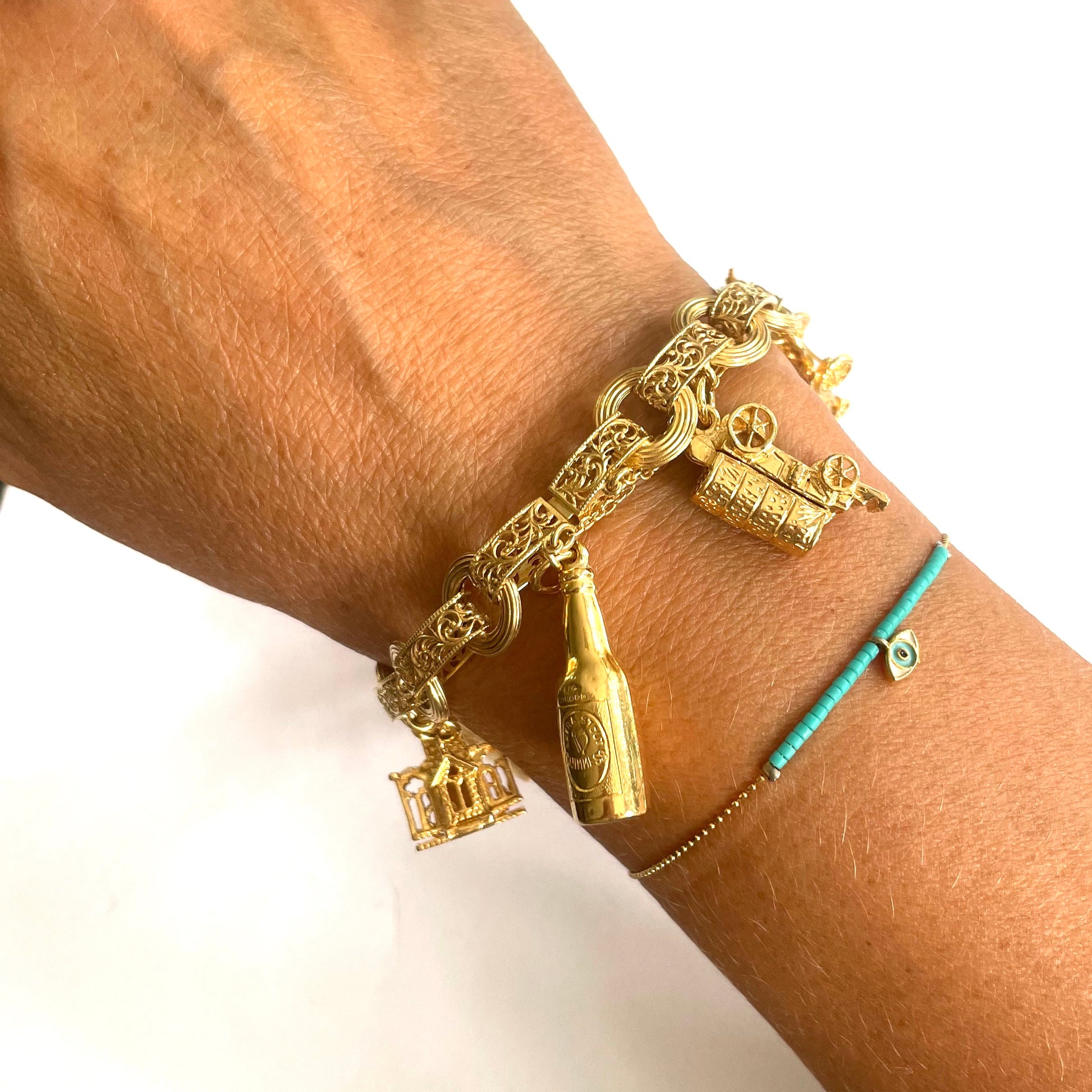 1950s 9KT Yellow Gold Charm Bracelet worn on wrist