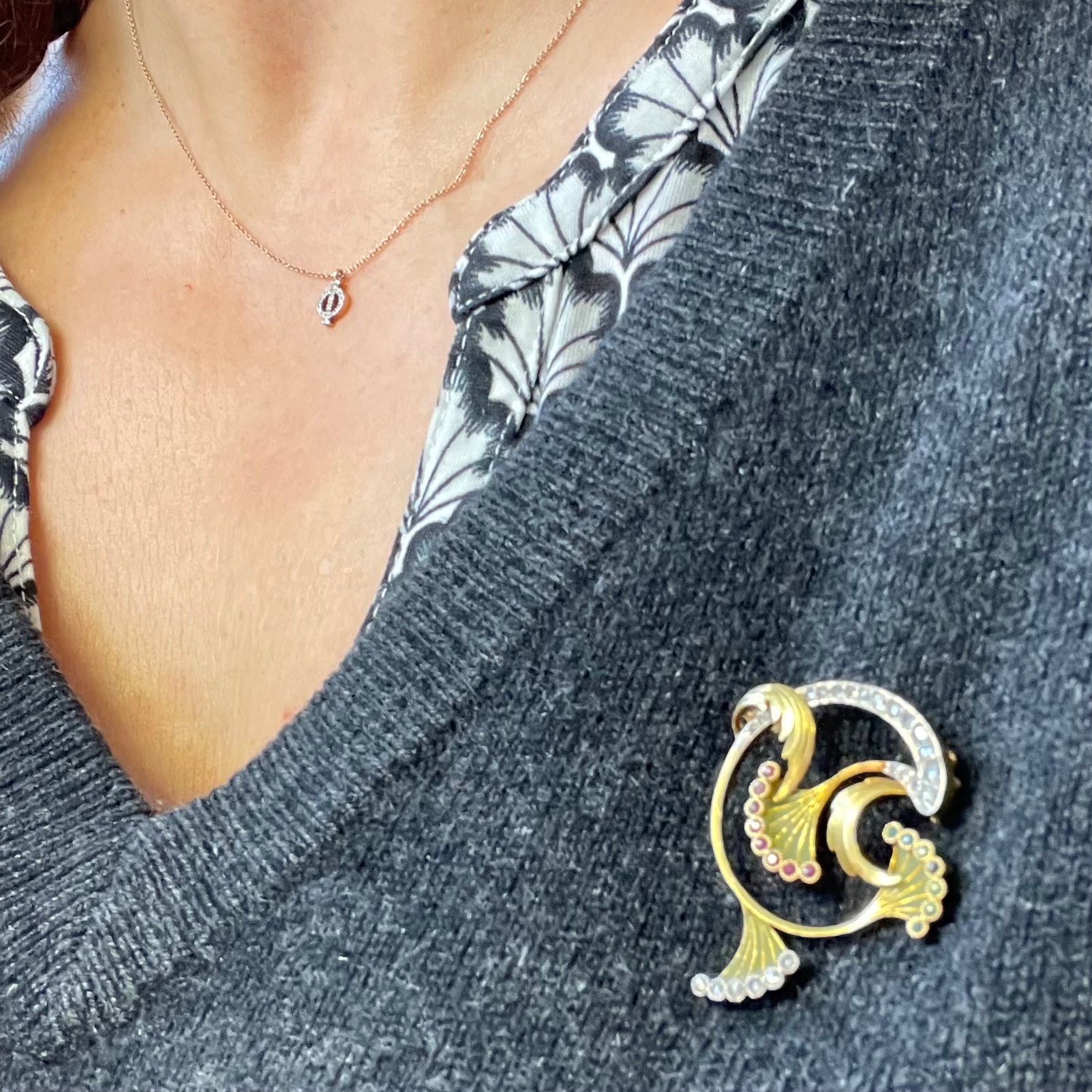 Art Nouveau 18KT Yellow Gold Enamel, Diamond, Emerald & Ruby Brooch worn on blouse