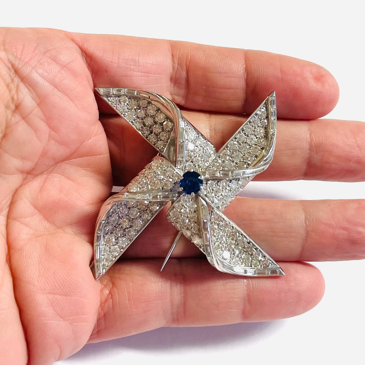 1960s Platinum Diamond & Sapphire Brooch in hand
