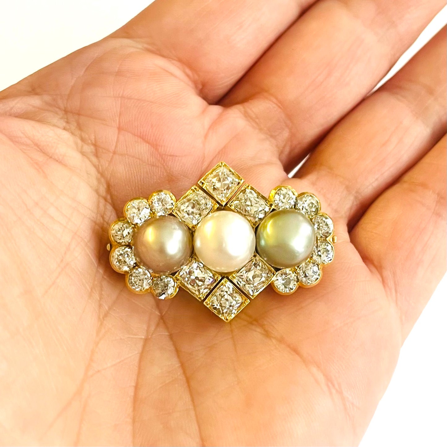 Bolin Victorian 18KT Yellow Gold Natural Pearl & Diamond Brooch/Pendant in hand