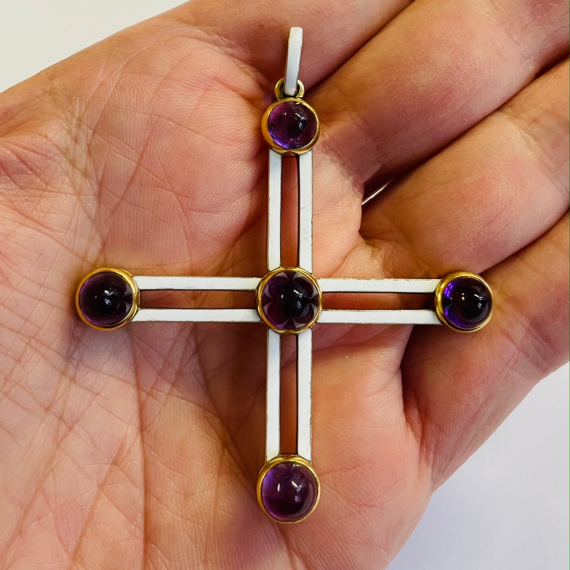 Victorian 18KT Yellow Gold Amethyst & Enamel Cross Pendant in hand