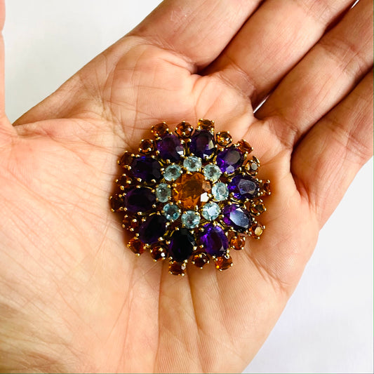 Mellerio French 1960s 18KT Yellow Gold Amethyst, Aquamarine & Citrine Brooch in hand