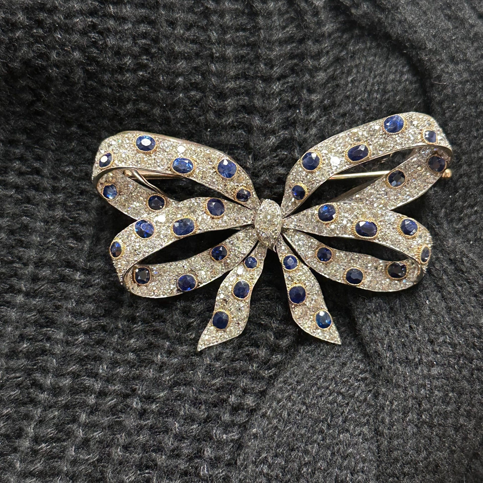 Chaumet Edwardian Platinum & 18KT Yellow Gold Sapphire & Diamond Bow Brooch on shirt