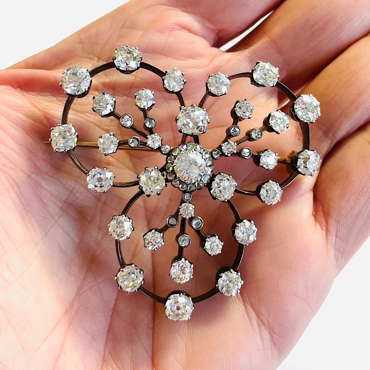 Victorian Silver & 18KT Yellow Gold Diamond Brooch in hand