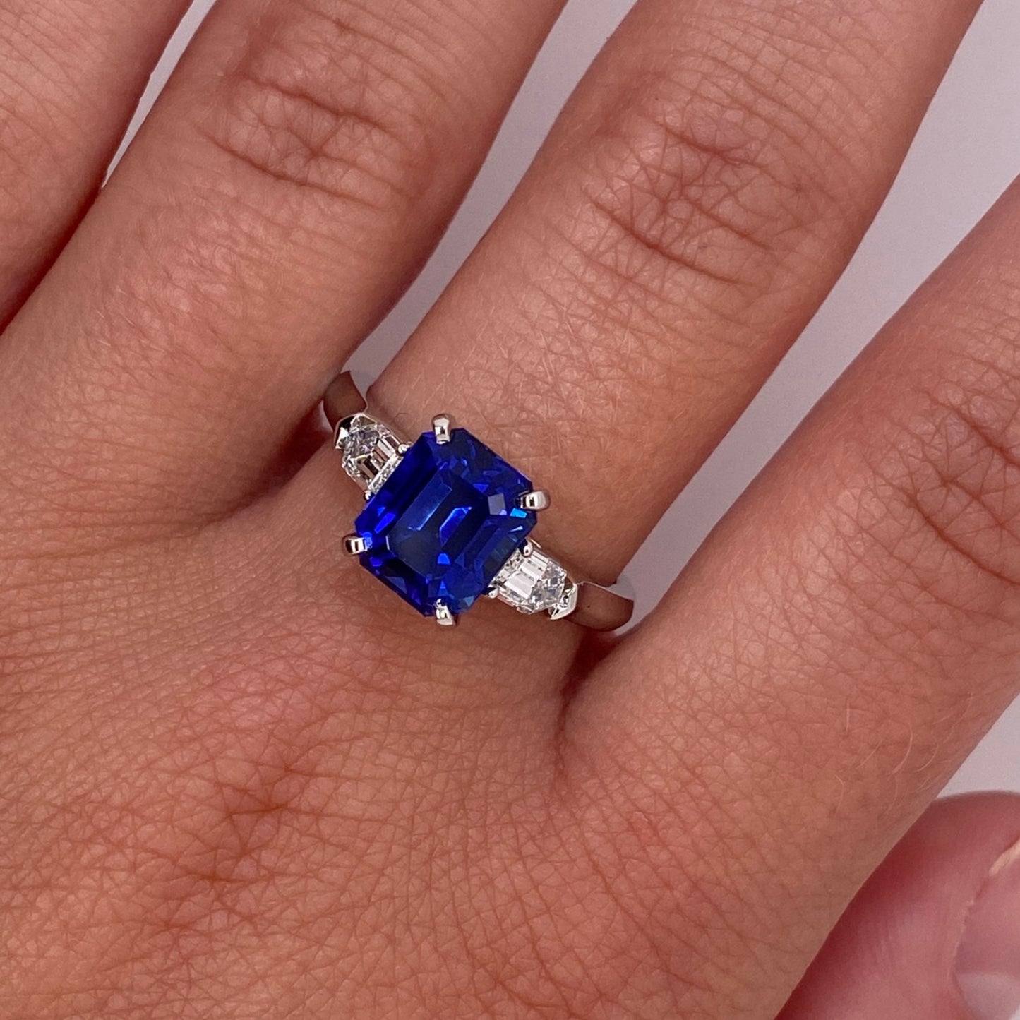 Contemporary Platinum Sapphire & Diamond Ring on finger