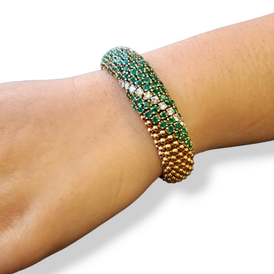 1960s 18KT Yellow Gold Emerald & Diamond Cous-Cous Bracelet on wrist