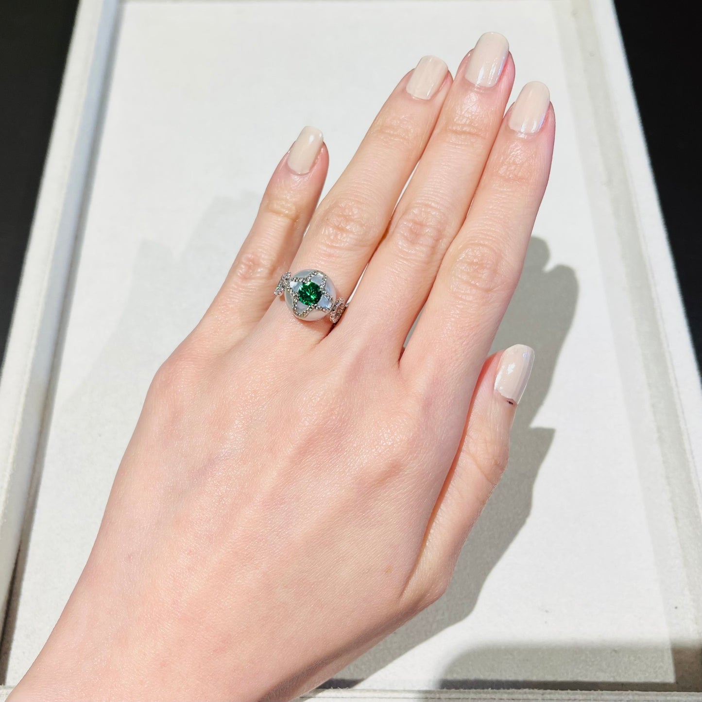 Contemporary 18KT White Gold Pearl, Diamond & Tsavorite Ring on hand