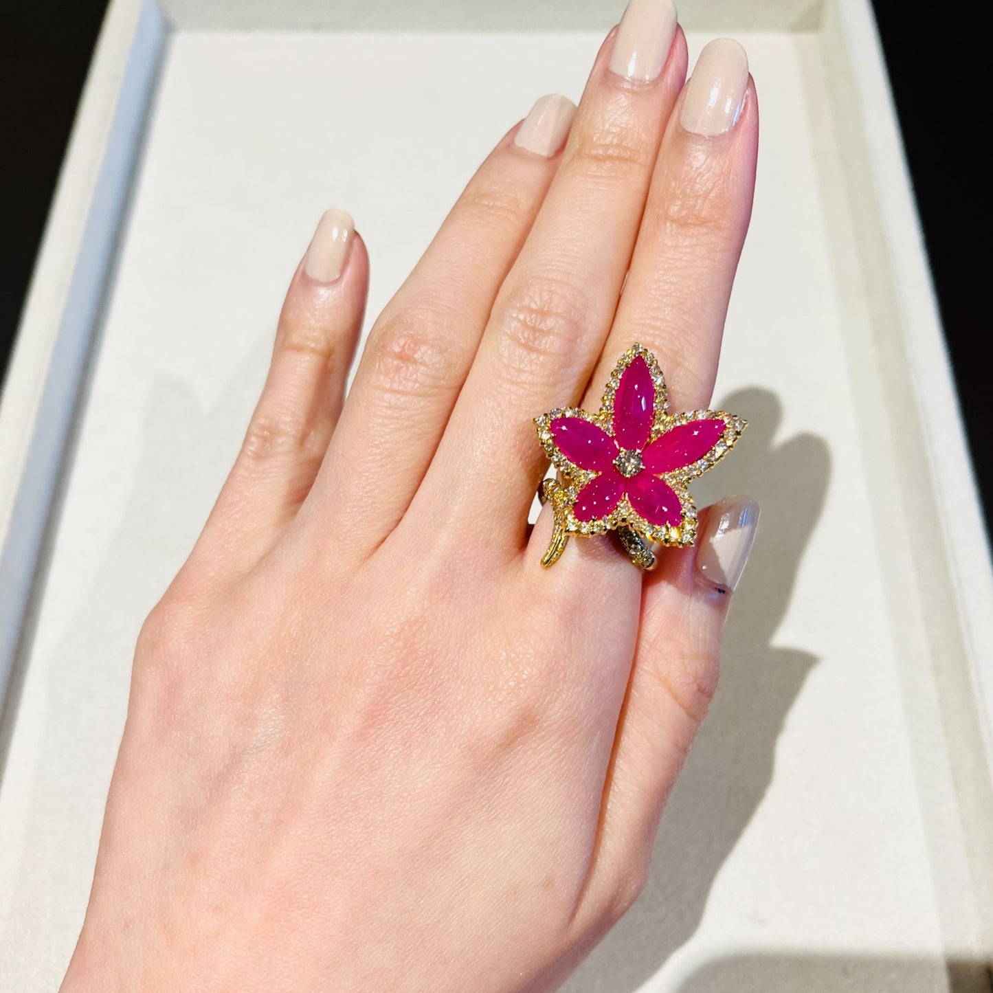 Contemporary Ruby & Diamond Flower Ring on hand