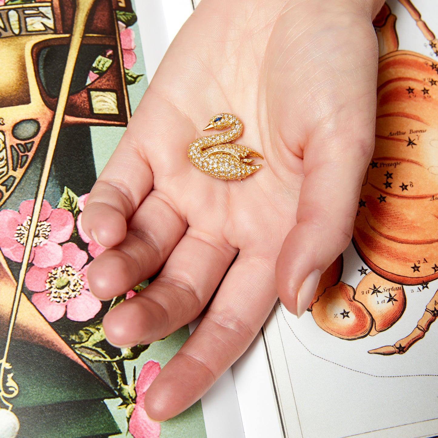 Van Cleef & Arpels NY Post-1980s 18KT Yellow Gold Sapphire & Diamond Swan Brooch in hand