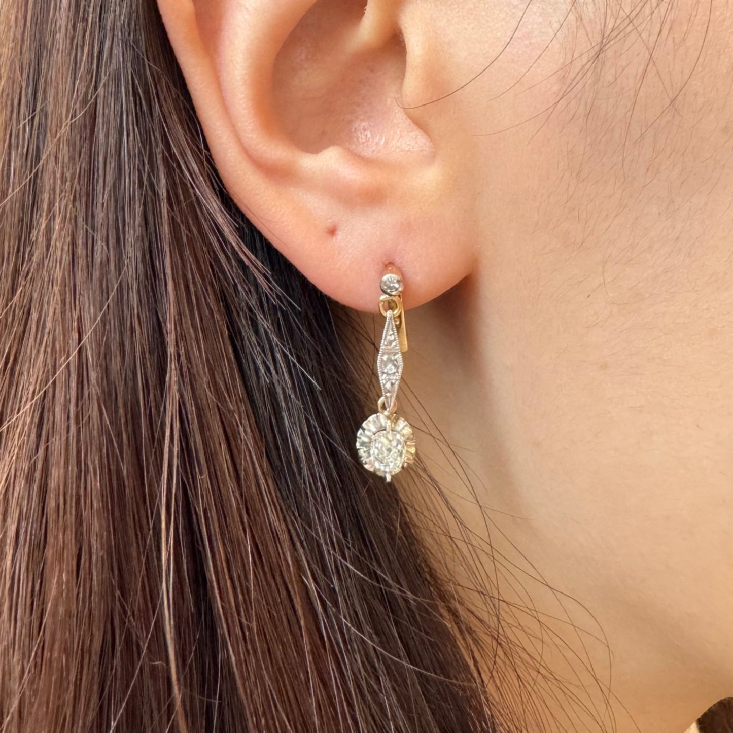 Post-1980s Platinum & 18KT Yellow Gold Diamond Earrings on ear