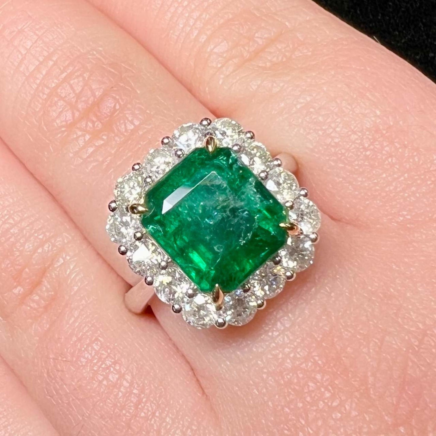 1980s 18KT White Gold Emerald & Diamond Ring on finger