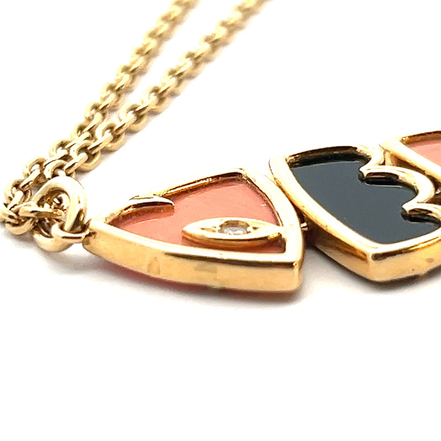 Van Cleef & Arpels French 1970s 18KT Yellow Gold Onyx, Coral & Diamond Set close-up details