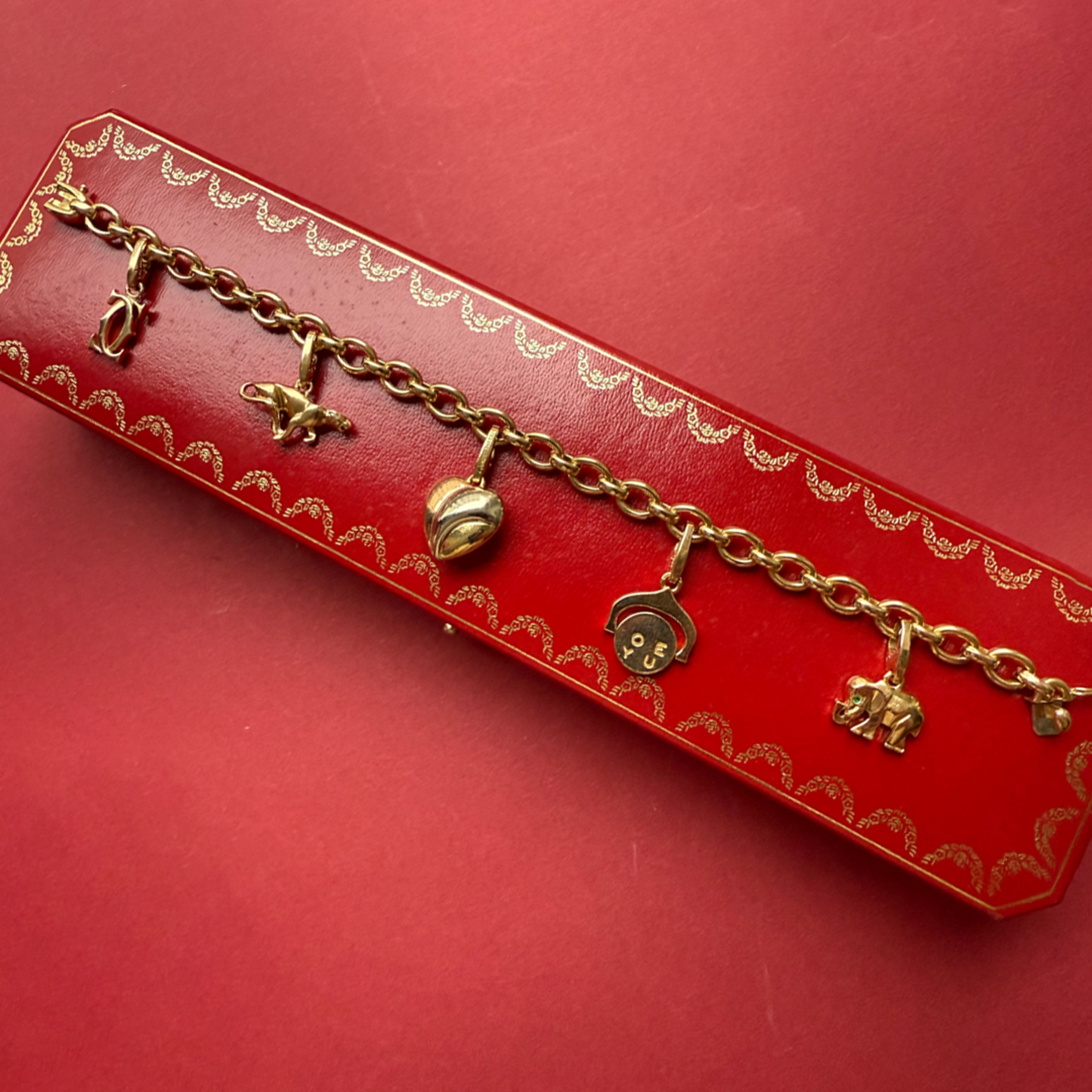 Cartier Post-1980s 18KT Yellow Gold Diamond Charm Bracelet on box