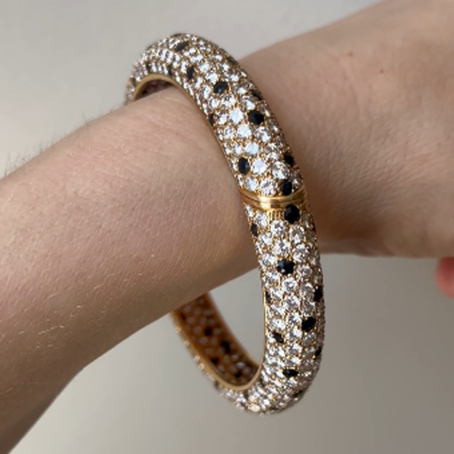 Van Cleef & Arpels France Post-1980s 18KT Yellow Gold Diamond & Onyx Bracelet on wrist