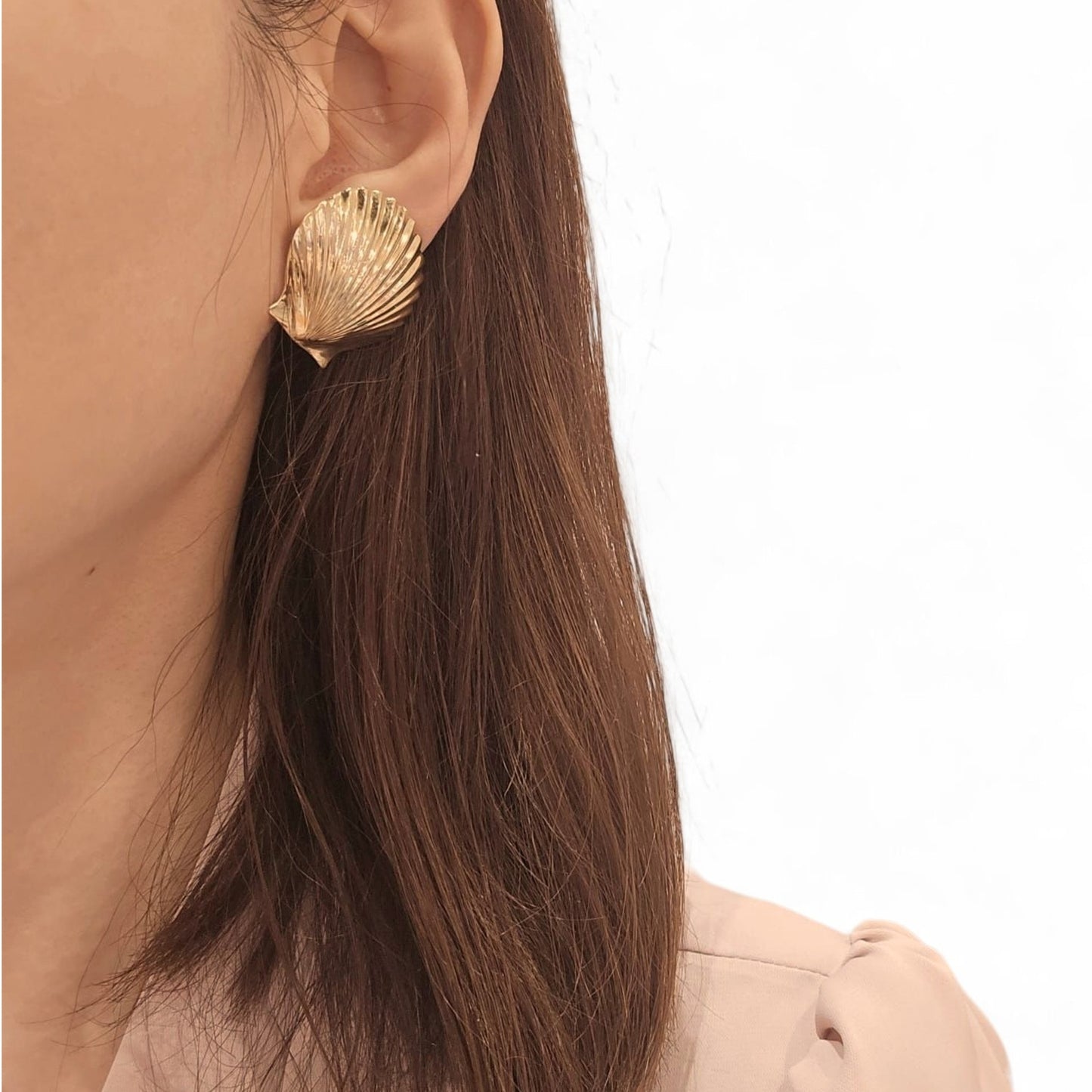Cartier 1960s 14KT Yellow Gold Shell Earrings on ear