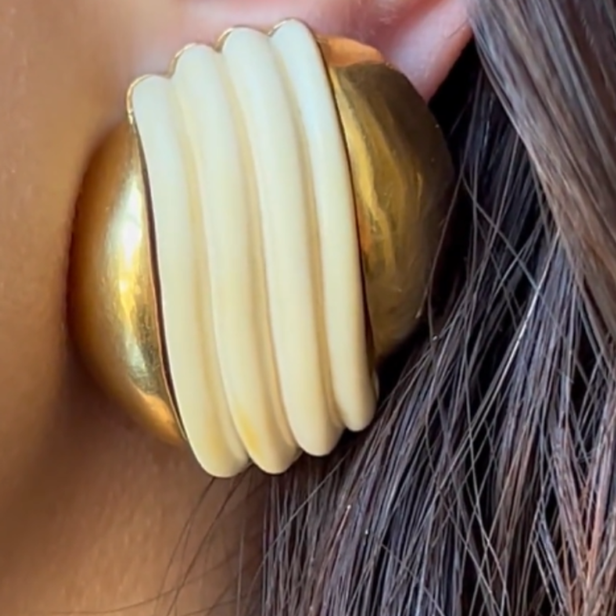 Cartier 1960s 18KT Yellow Gold Earrings close-up on ear
