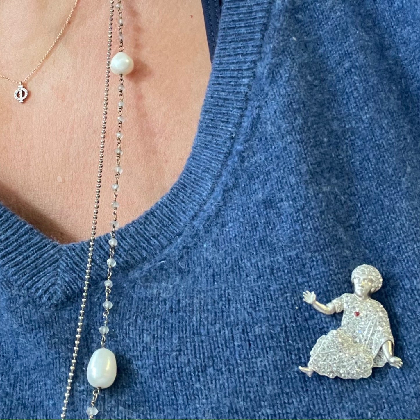 1930s Platinum Diamond & Enamel "Baby" Roman Emperor Brooch worn on shirt