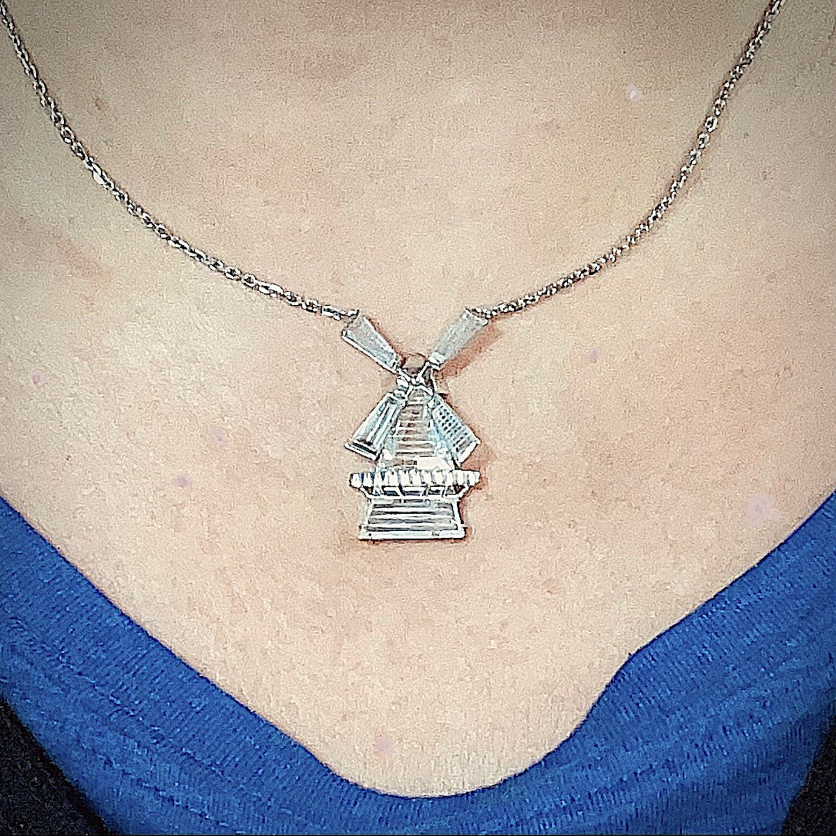 1970s Platinum Diamond Windmill Pendant worn on neck