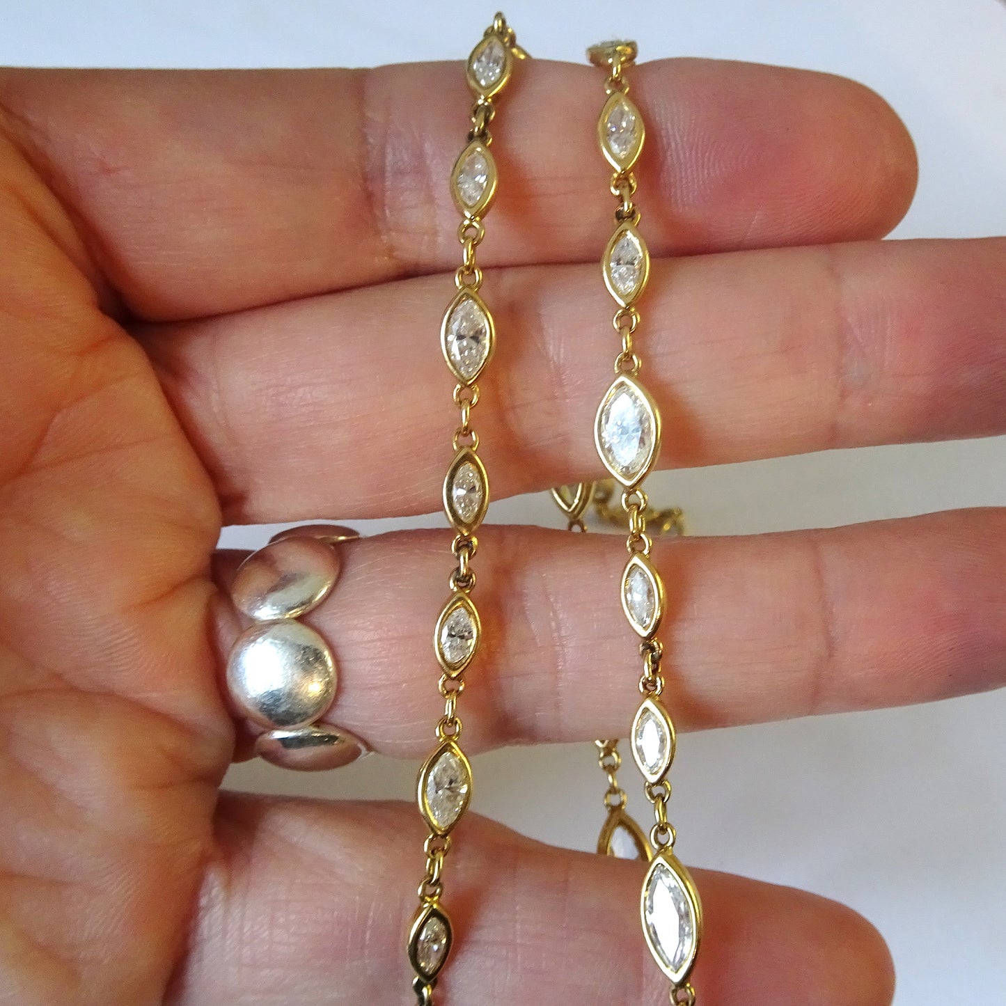 Post-1980s 18KT Yellow Gold Marquise Diamond Necklace in hand