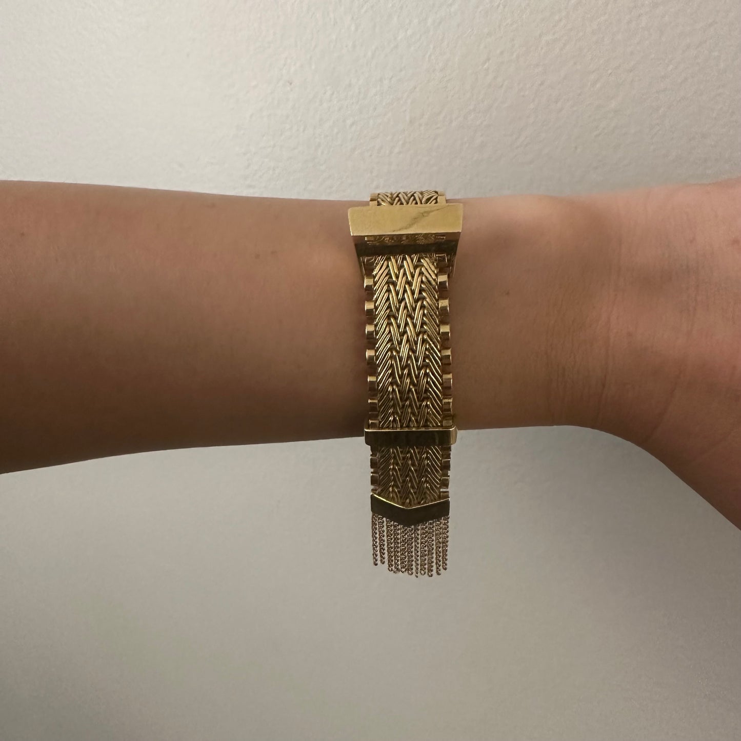 1960s 18KT Yellow Gold Tassel Bracelet worn on wrist