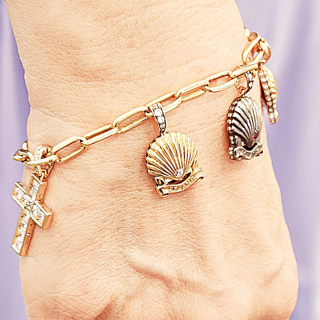 Cartier 1980s Silver & 18KT Yellow Gold Diamond Charm Bracelet worn on wrist