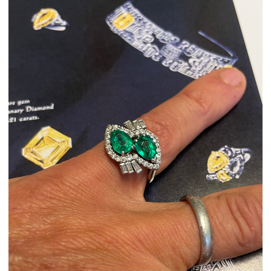 Bailey, Banks & Biddle 1950s Platinum Emerald & Diamond Bypass Ring on finger
