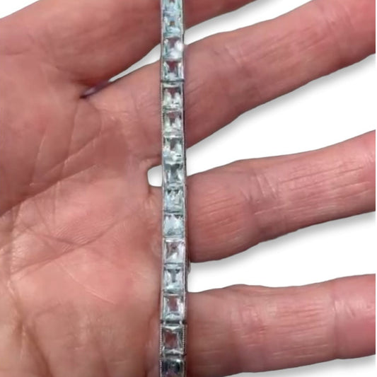Post-1980s Platinum Aquamarine Line Bracelet in hand
