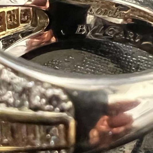 Bulgari Post-1980s Platinum & 18KT Yellow Gold Sapphire & Diamond Trombino Ring close-up of signature