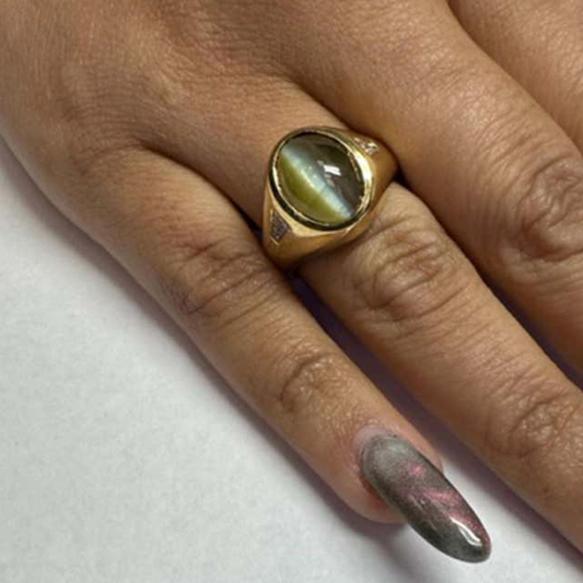 Cat’s eye, diamond and 18-karat gold ring, circa 1950s.