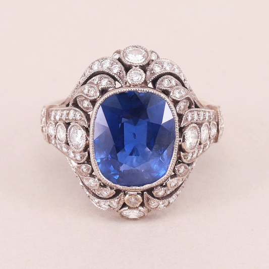 Diamond, bezel set sapphire and 18-karat gold ring