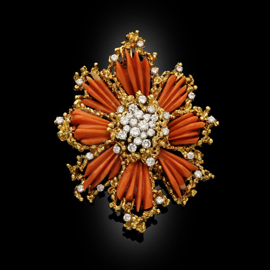 Diamond, carved coral and 18-karat gold starburst brooch, signed Kutchinsky, circa 1969.