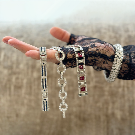 Art Deco Tiffany & Co. diamond, sapphire and platinum bracelet; French diamond and platinum bracelet; Art Deco diamond, ruby and platinum bracelet, circa 1930; Bombe diamond and platinum bracelet, circa 1950s.