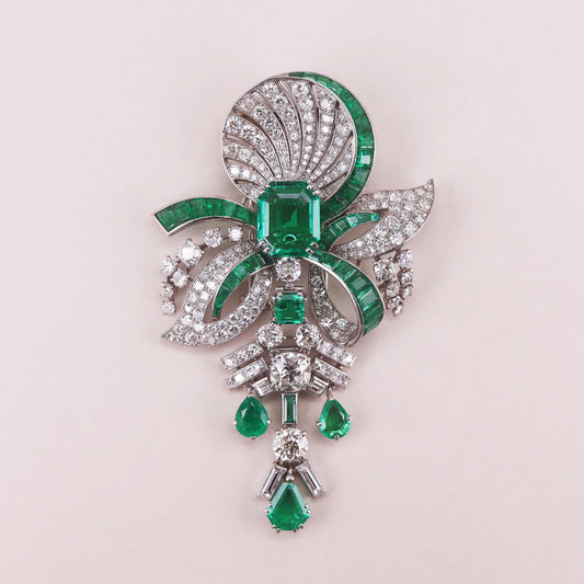 Art Deco diamond, 5.59-carat Colombian emerald and 18-karat white-gold brooch, signed Mauboussin, accompanied by an SSEF Report for the central emerald.