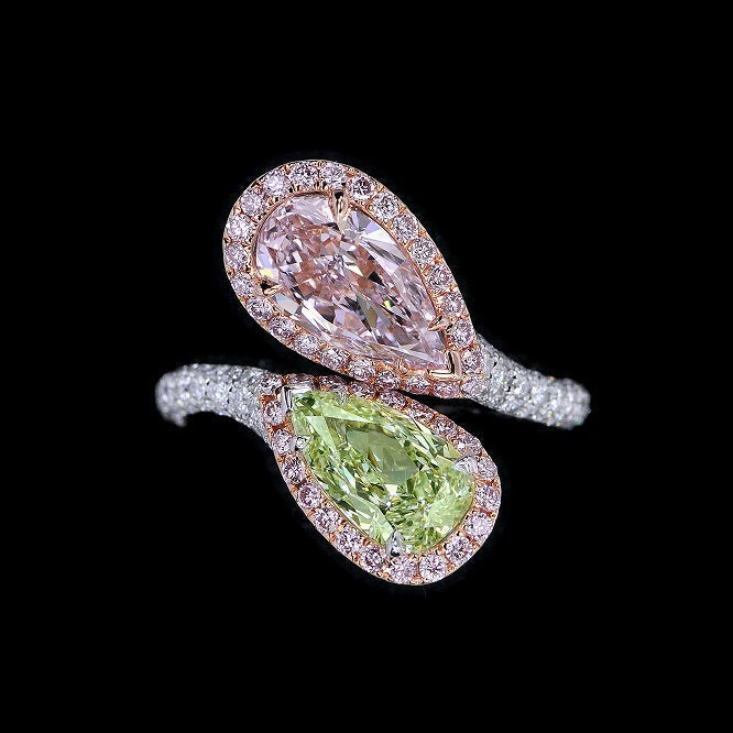 Fancy purplish pink and fancy Light yellow-green pear shape diamonds mounted in 18-karat gold, accompanied by a GIA report.