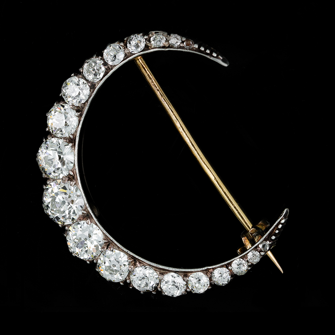 Victorian diamond, 18-karat gold and silver crescent moon brooch, circa 1880.