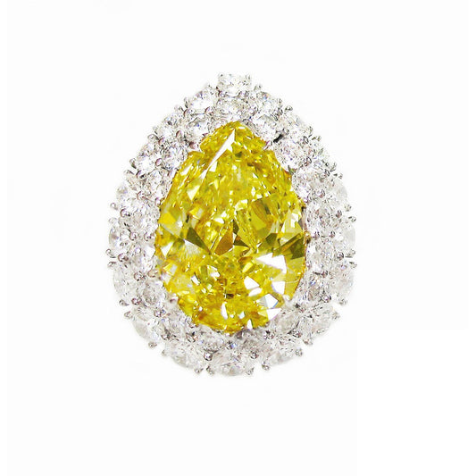 5.88-carat vivid yellow diamond, white diamond and platinum ring.