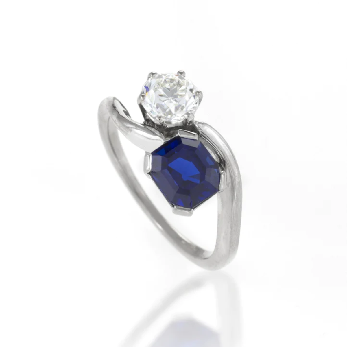 1980s Platinum Sapphire & Diamond Ring angled front view