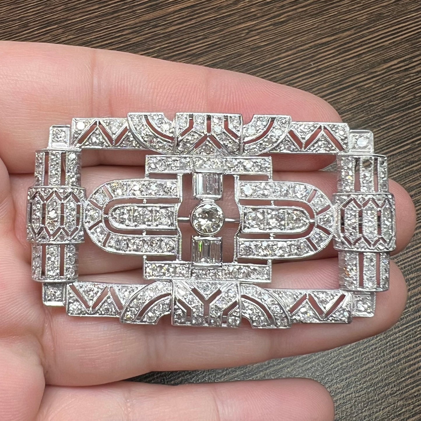 Art Deco Platinum Diamond Brooch in hand