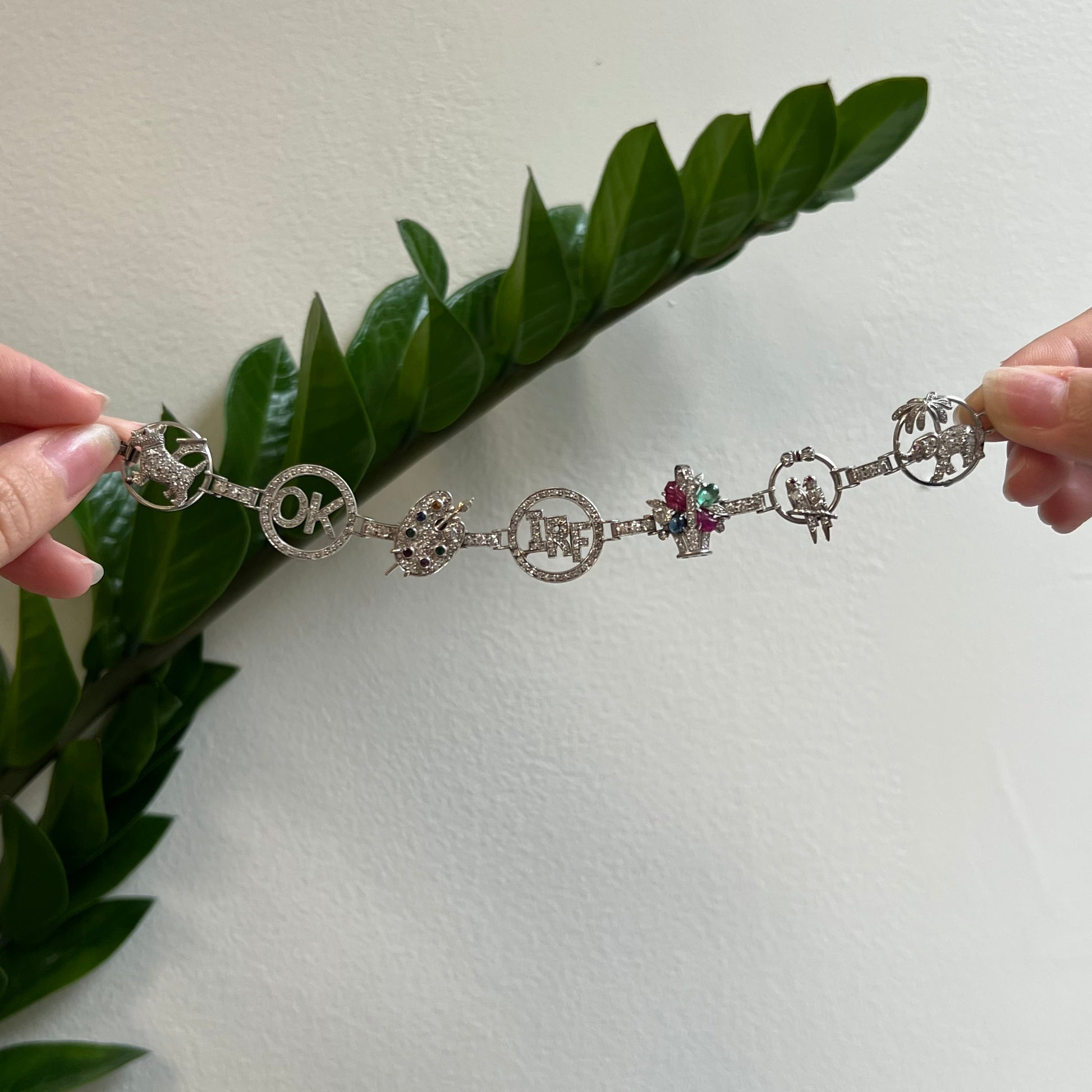 Art Deco Platinum Diamond, Emerald, Ruby & Sapphire Charm Bracelet front view