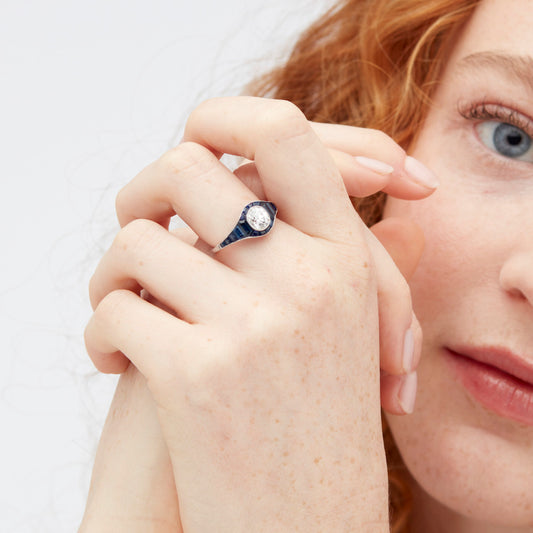 Post-1980s Platinum Diamond & Sapphire Ring worn on hand