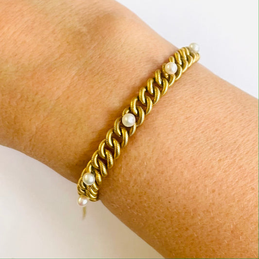 French 1930s 18KT Yellow Gold Natural Pearl Bracelet worn on wrist