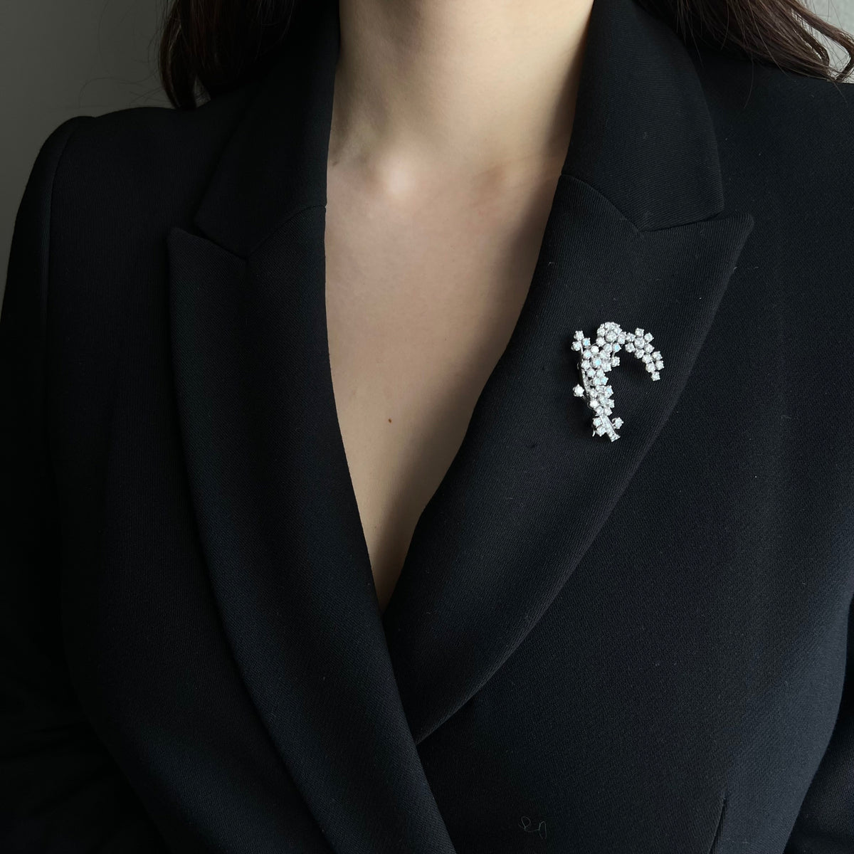 Crystal brooch accenting the neckline of an evening dress